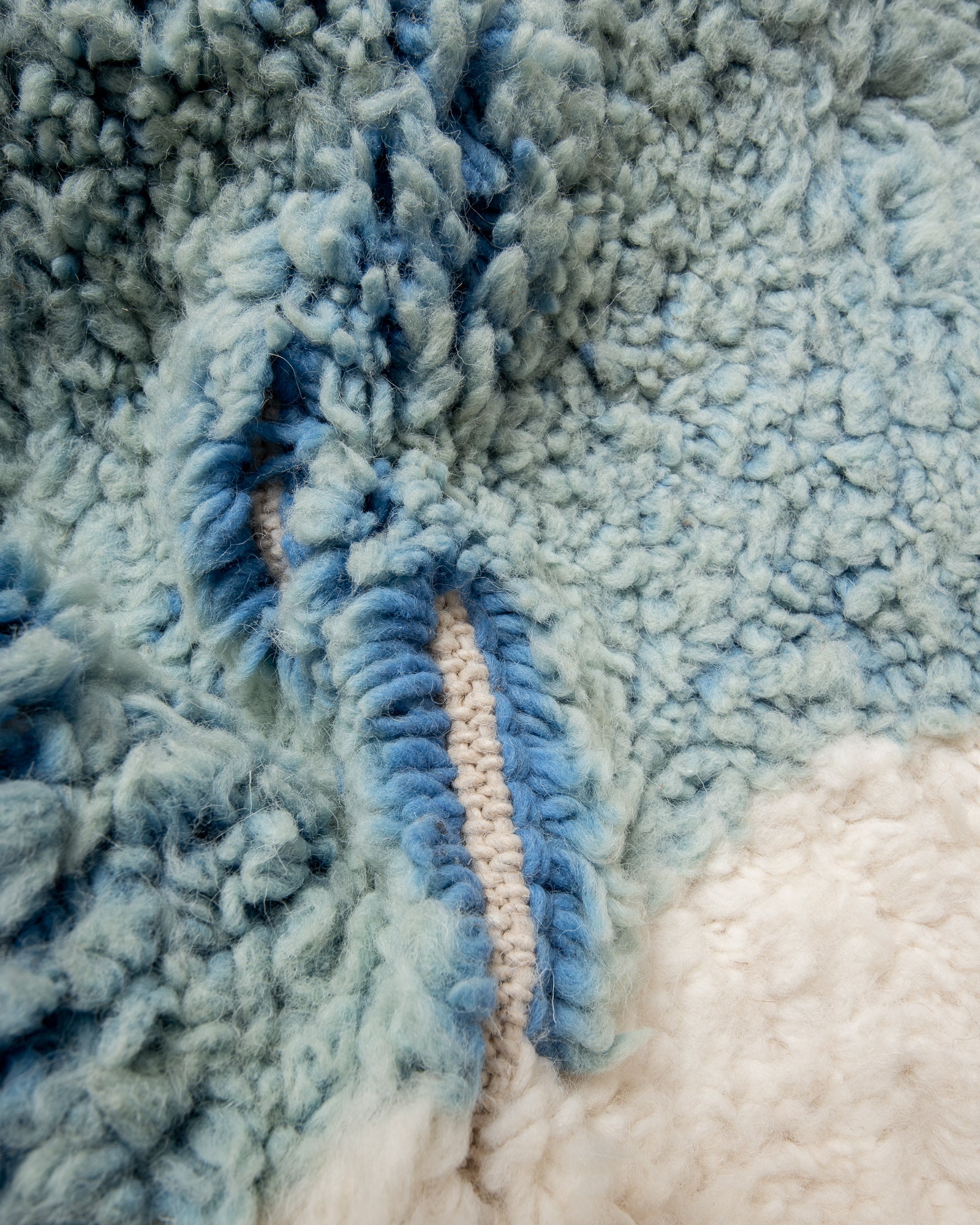 Modern, designer, handcrafted Berber rug from Morocco. Beniourain carpet with beautiful colours and patterns and fluffy wool texture.